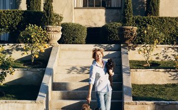 ellen pompeo plays with her toy poodles gigi and valentin, beside the swimming pool at her home in the hollywood hills