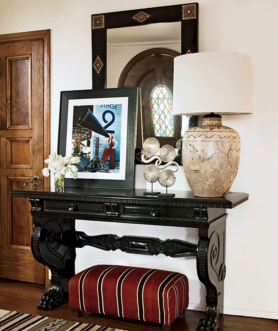 the foyer features a chinese lamp from nathan turner and a moroccan ottoman