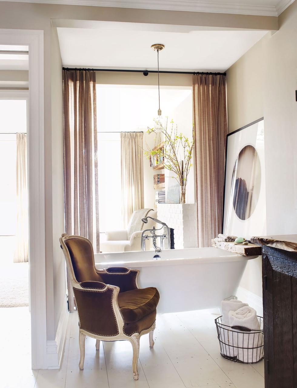 a victoria albert claw foot tub with fittings by samuel heath in the master bath