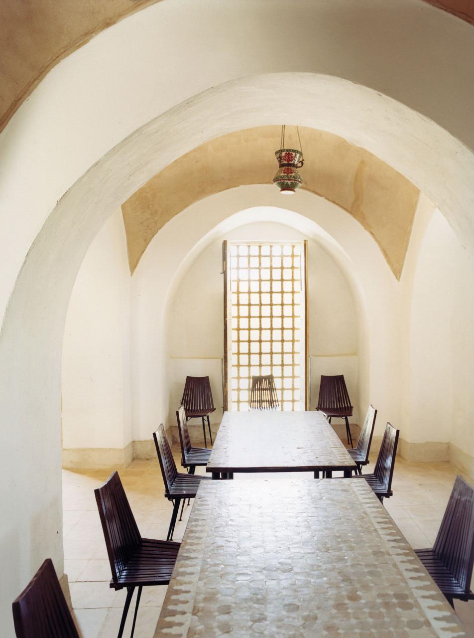 the moroccan dining tables are inlaid with zelige a form of tile work