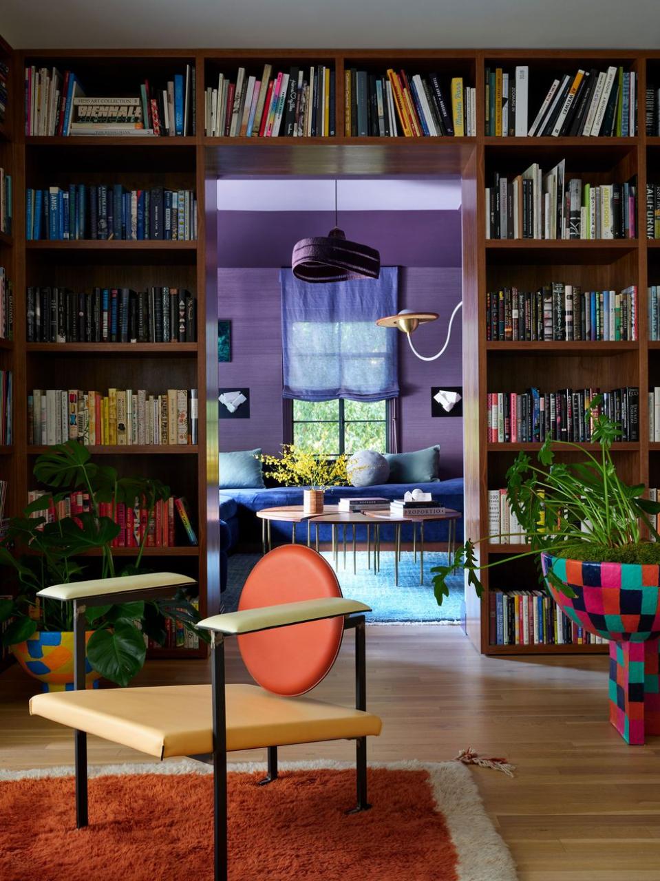 a room with a table and bookshelves